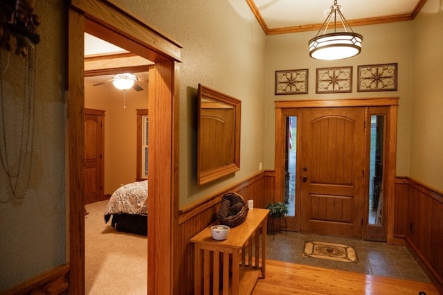 8295 Ridgecrest Ln, Rogers, AR 72756 - entryway with wainscoting, crown molding, and ceiling fan