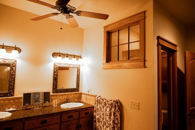 8295 Ridgecrest Ln, Rogers, AR 72756 - full bathroom with tasteful backsplash, ceiling fan, and double vanity