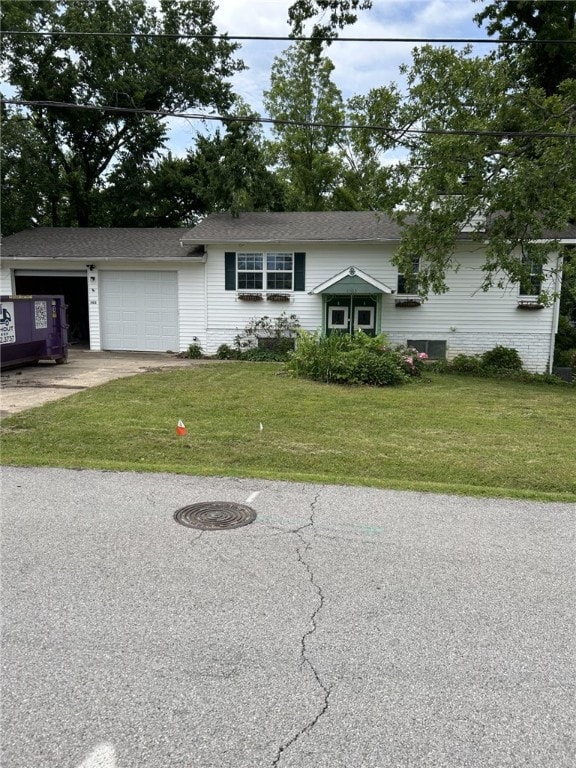 1103 NW 10th St, Bentonville, AR 72712 - view of front facade with a front yard, concrete driveway, and an attached garage