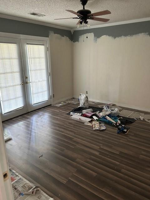 1103 NW 10th St, Bentonville, AR 72712 - unfurnished room with french doors, a textured ceiling, a ceiling fan, ornamental molding, and wood finished floors