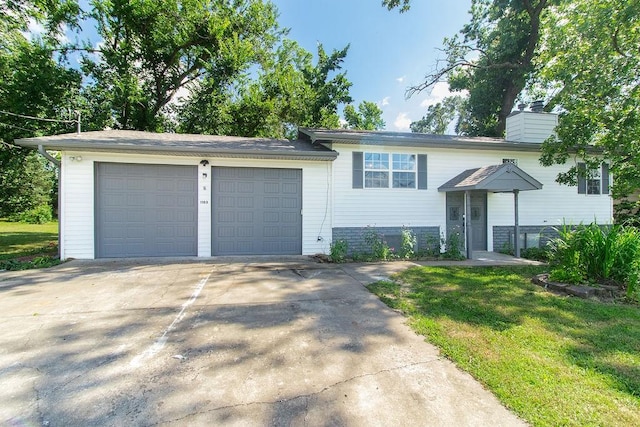 1103 NW 10th St, Bentonville, AR 72712 - view of front of home featuring driveway, an attached garage, a chimney, and a front yard