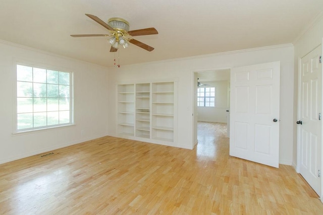 1103 NW 10th St, Bentonville, AR 72712 - spare room with ornamental molding, light wood-type flooring, ceiling fan, and built in shelves