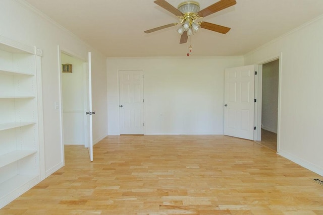 1103 NW 10th St, Bentonville, AR 72712 - unfurnished room with ornamental molding, light wood-style floors, a ceiling fan, and built in features