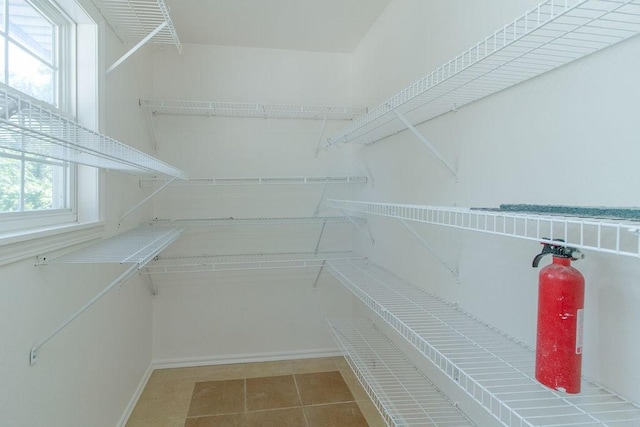 1103 NW 10th St, Bentonville, AR 72712 - walk in closet featuring tile patterned floors