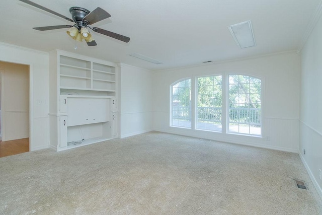 1103 NW 10th St, Bentonville, AR 72712 - spare room with carpet floors, ornamental molding, and ceiling fan