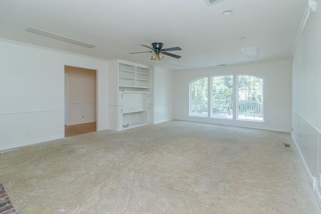1103 NW 10th St, Bentonville, AR 72712 - carpeted empty room featuring crown molding, a ceiling fan, built in features, attic access, and a wainscoted wall