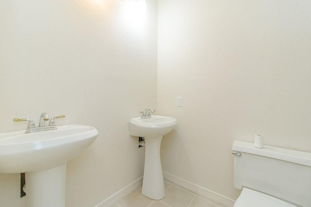 1103 NW 10th St, Bentonville, AR 72712 - half bath with toilet and tile patterned floors