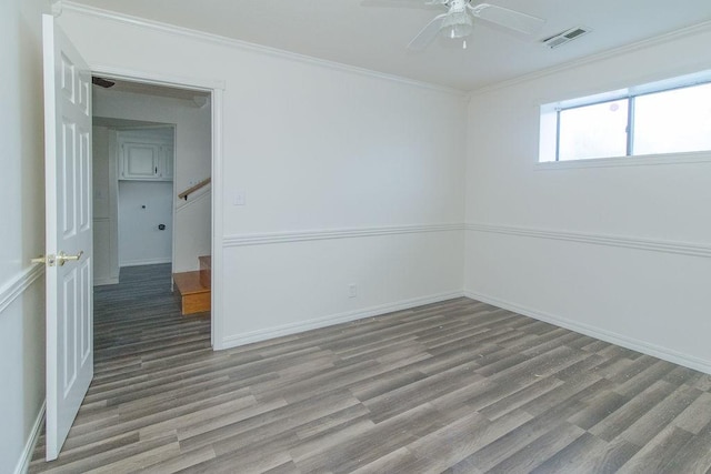 1103 NW 10th St, Bentonville, AR 72712 - empty room featuring wood finished floors, a ceiling fan, and ornamental molding