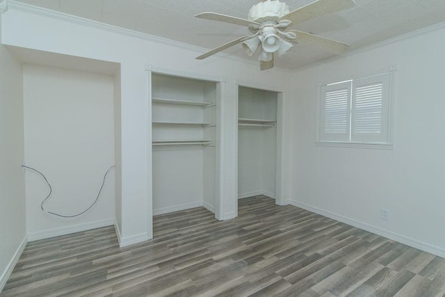 1103 NW 10th St, Bentonville, AR 72712 - unfurnished bedroom with wood finished floors, crown molding, and ceiling fan