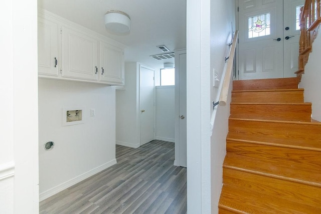 1103 NW 10th St, Bentonville, AR 72712 - laundry room with washer hookup, cabinet space, and light wood finished floors