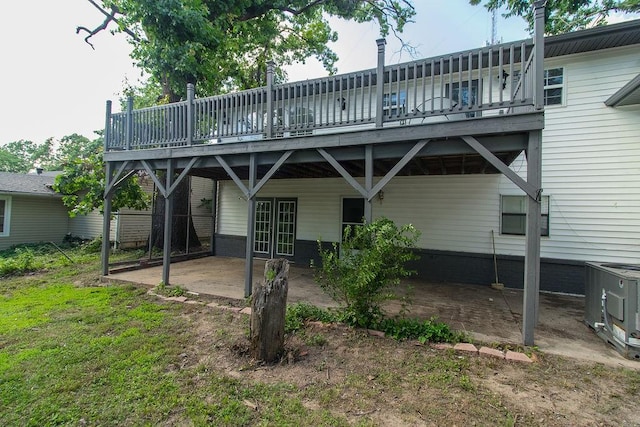 1103 NW 10th St, Bentonville, AR 72712 - back of property with a patio and a deck