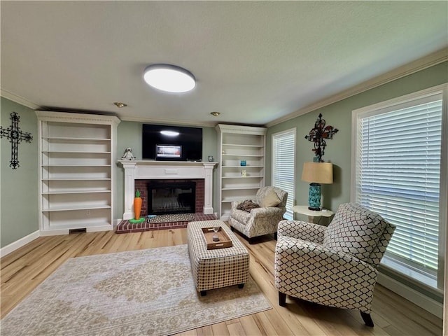 904 Deerfield Ct, Russellville, AR 72801 - living room featuring ornamental molding, wood finished floors, a fireplace, plenty of natural light, and a textured ceiling