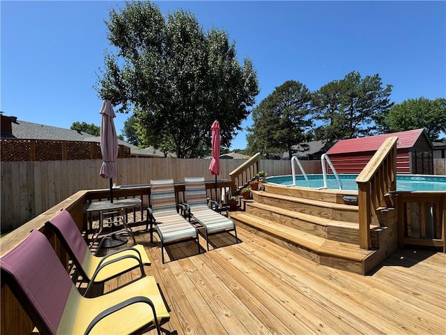 904 Deerfield Ct, Russellville, AR 72801 - wooden terrace featuring a fenced backyard and a shed
