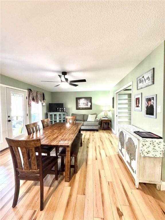 904 Deerfield Ct, Russellville, AR 72801 - dining room featuring ceiling fan, light wood-type flooring, and a textured ceiling