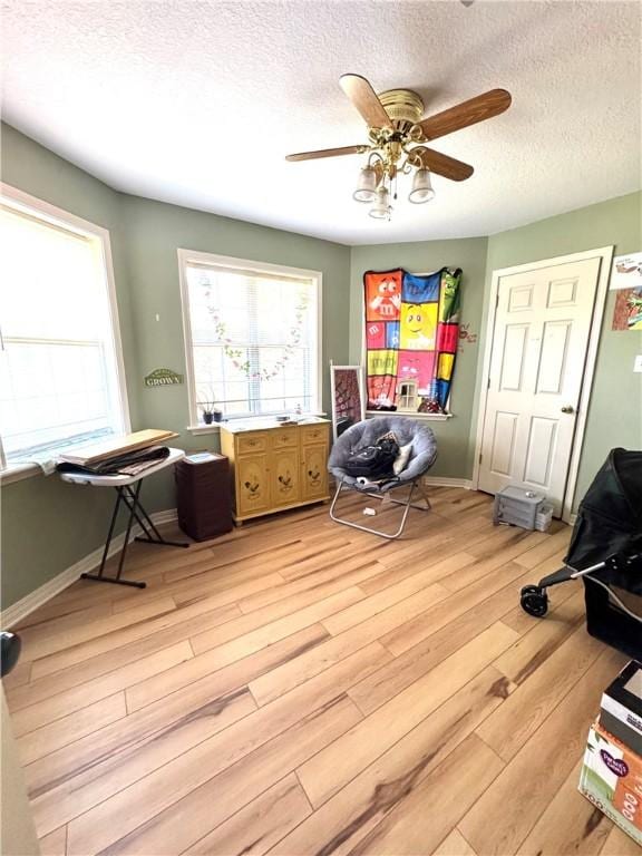 904 Deerfield Ct, Russellville, AR 72801 - office space featuring light wood-type flooring, a textured ceiling, a ceiling fan, and baseboards