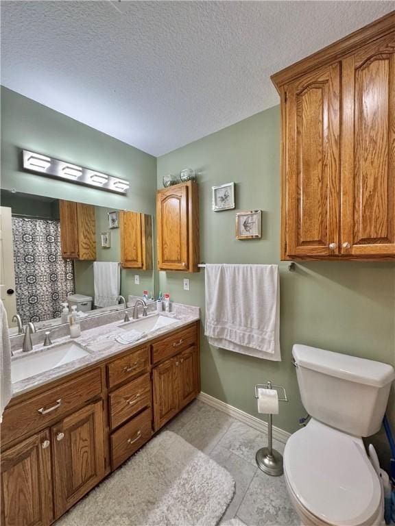 904 Deerfield Ct, Russellville, AR 72801 - full bathroom featuring toilet, double vanity, baseboards, a textured ceiling, and curtained shower