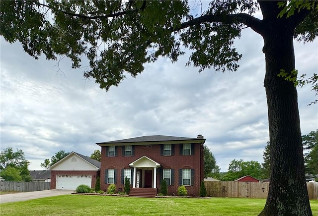 904 Deerfield Ct, Russellville, AR 72801 - colonial inspired home featuring brick siding, concrete driveway, and a garage
