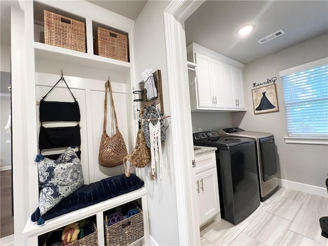 219 Kinross Dr, Bella Vista, AR 72715 - washroom featuring cabinet space, washer and clothes dryer, and baseboards