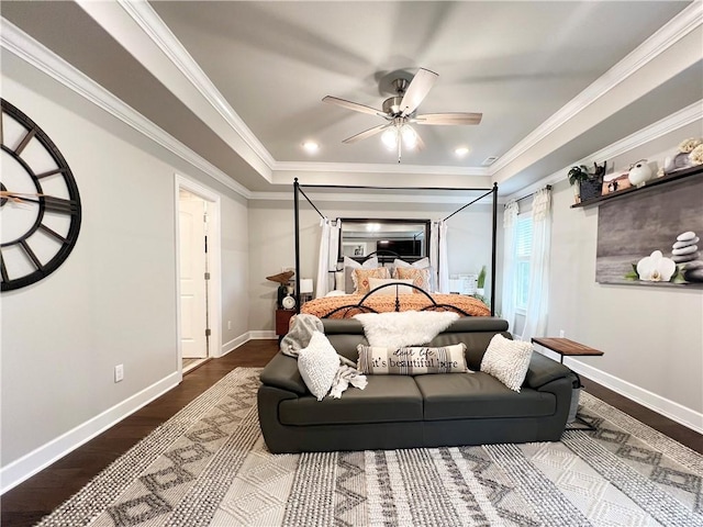 219 Kinross Dr, Bella Vista, AR 72715 - bedroom featuring dark wood-type flooring, baseboards, crown molding, a tray ceiling, and ceiling fan