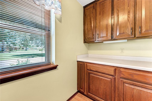 2001 W Magnolia St, Rogers, AR 72758 - kitchen featuring brown cabinetry and light countertops