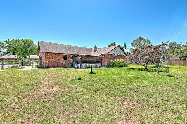 2001 W Magnolia St, Rogers, AR 72758 - rear view of property featuring brick siding and a sunroom