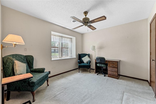 2001 W Magnolia St, Rogers, AR 72758 - living area with carpet, a ceiling fan, baseboards, and a textured ceiling