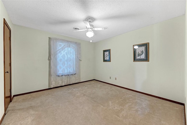 2001 W Magnolia St, Rogers, AR 72758 - carpeted spare room with baseboards, ceiling fan, and a textured ceiling