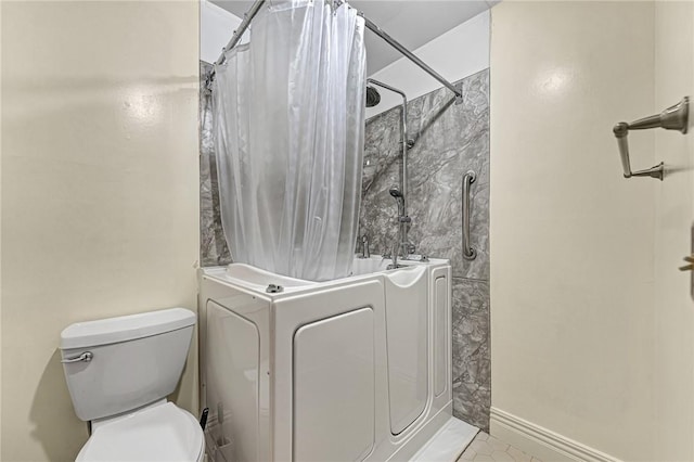 2001 W Magnolia St, Rogers, AR 72758 - full bathroom featuring shower / bath combo with shower curtain, toilet, and tile patterned floors
