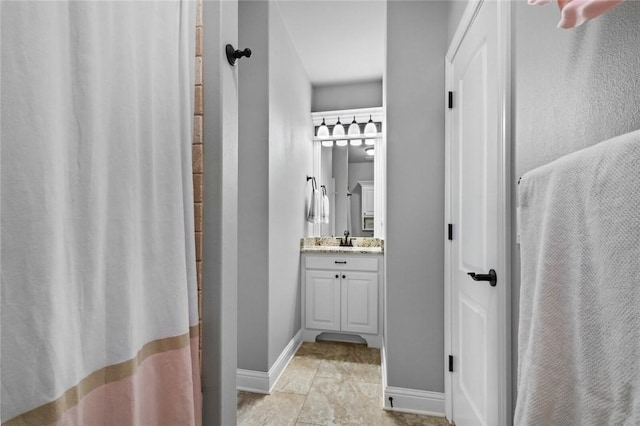 6401 S 47th St, Rogers, AR 72758 - bathroom featuring vanity, baseboards, and tile patterned flooring