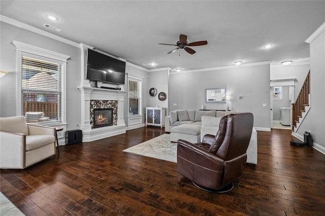 6401 S 47th St, Rogers, AR 72758 - living room featuring a ceiling fan, hardwood / wood-style floors, ornamental molding, a glass covered fireplace, and recessed lighting