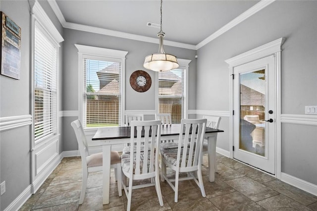 6401 S 47th St, Rogers, AR 72758 - dining space featuring crown molding and stone finish flooring