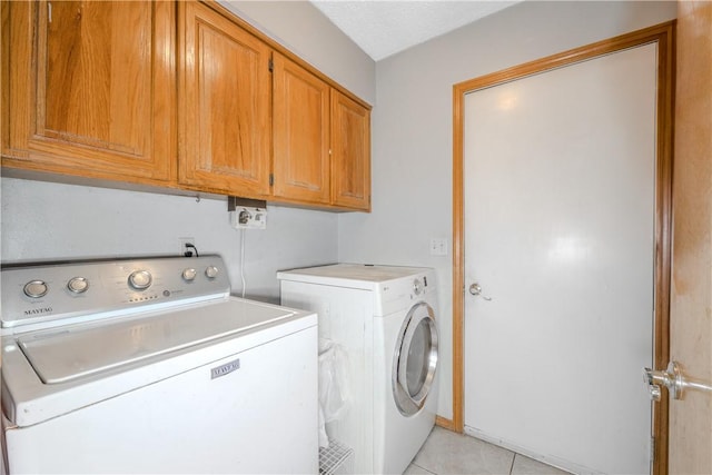 6 Runnymede Ln, Bella Vista, AR 72715 - washroom with cabinet space, separate washer and dryer, and light tile patterned flooring