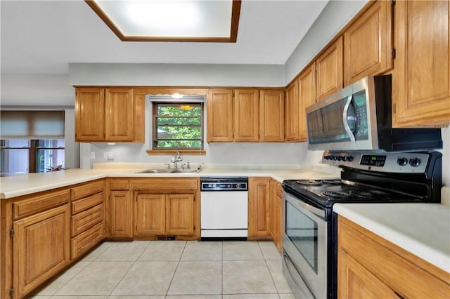 6 Runnymede Ln, Bella Vista, AR 72715 - kitchen featuring appliances with stainless steel finishes, a sink, light countertops, light tile patterned flooring, and brown cabinets