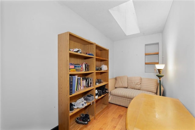 6 Runnymede Ln, Bella Vista, AR 72715 - sitting room with a skylight and light wood-style floors