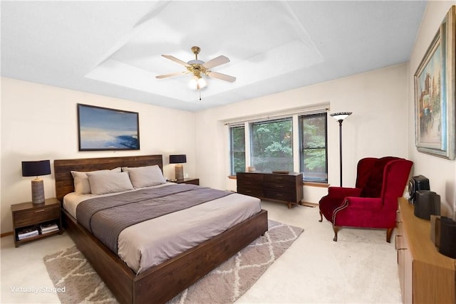 6 Runnymede Ln, Bella Vista, AR 72715 - bedroom with light carpet, a tray ceiling, and ceiling fan