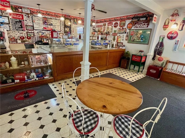 273 N Main St, Eureka Springs, AR 72632 - dining area with tile patterned floors, a community bar, and ornate columns