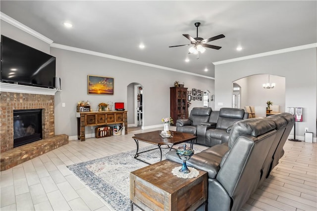 2300 Cameo Ln, Bentonville, AR 72712 - living area featuring arched walkways, a ceiling fan, crown molding, a brick fireplace, and baseboards