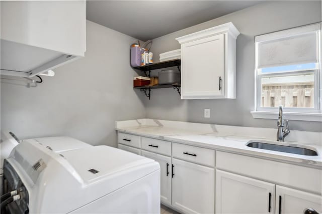 2300 Cameo Ln, Bentonville, AR 72712 - laundry room with washer and clothes dryer and cabinet space