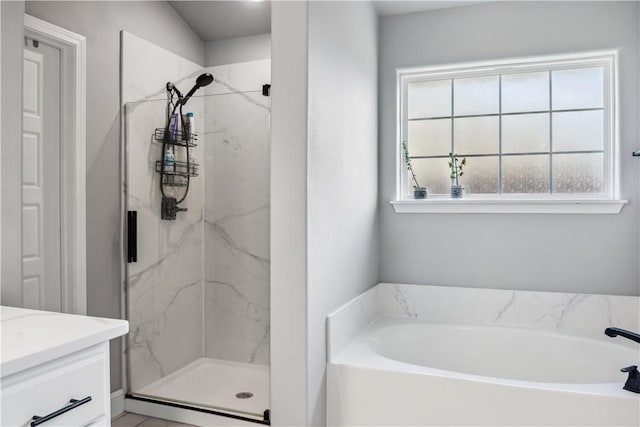2300 Cameo Ln, Bentonville, AR 72712 - bathroom featuring a garden tub, a marble finish shower, and vanity