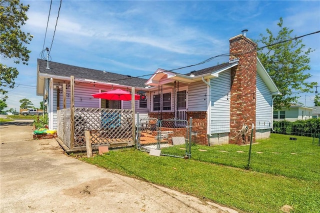 521 S 13th St, Rogers, AR 72758 - back of property with a chimney, a gate, and a shingled roof