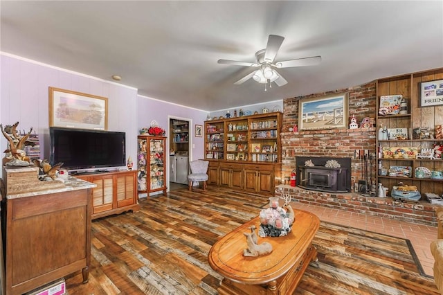 521 S 13th St, Rogers, AR 72758 - living area with ceiling fan, wood finished floors, and a wood stove