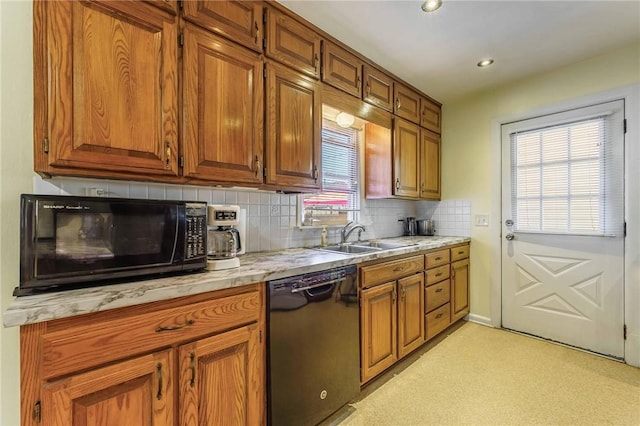 521 S 13th St, Rogers, AR 72758 - kitchen featuring black appliances, a sink, light countertops, decorative backsplash, and brown cabinets