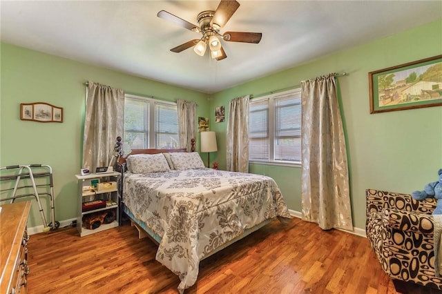 521 S 13th St, Rogers, AR 72758 - bedroom with multiple windows, wood finished floors, and baseboards