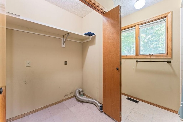 4 Wincanton Ln, Bella Vista, AR 72715 - laundry room with electric dryer hookup, a textured ceiling, and baseboards