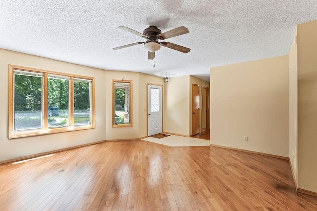 4 Wincanton Ln, Bella Vista, AR 72715 - unfurnished room featuring a ceiling fan, a textured ceiling, light wood-style flooring, and baseboards