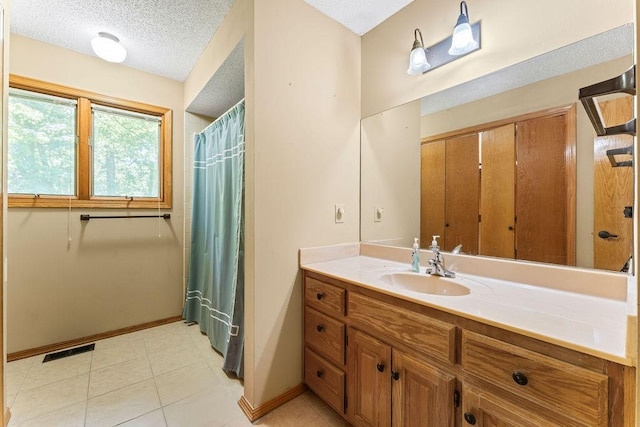 4 Wincanton Ln, Bella Vista, AR 72715 - bathroom featuring vanity, baseboards, a textured ceiling, a shower with shower curtain, and tile patterned flooring