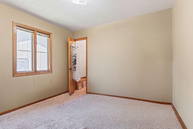 4 Wincanton Ln, Bella Vista, AR 72715 - unfurnished room featuring light carpet, a textured ceiling, and baseboards