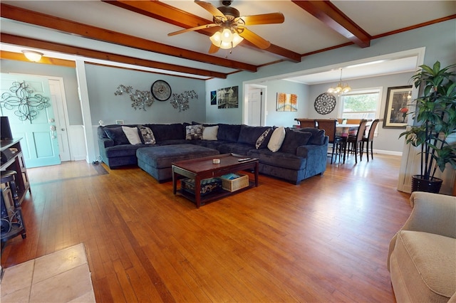 220 W Highland St, Siloam Springs, AR 72761 - living area featuring light wood-style floors, beam ceiling, ceiling fan, a chandelier, and baseboards