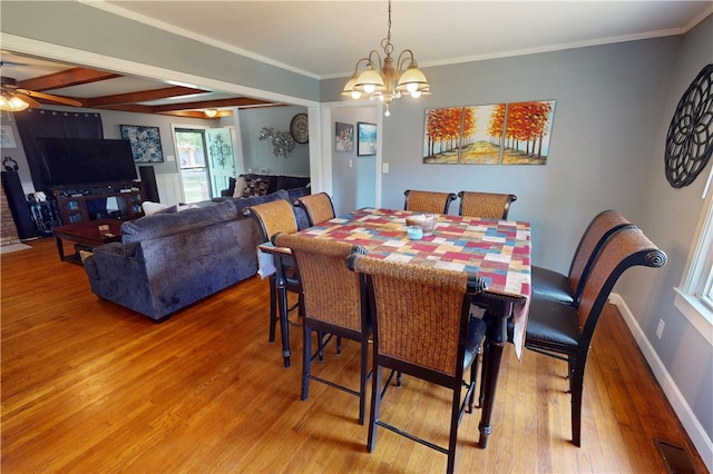 220 W Highland St, Siloam Springs, AR 72761 - dining area featuring light wood-type flooring, a chandelier, a ceiling fan, ornamental molding, and baseboards