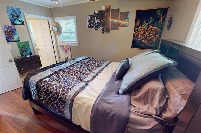 220 W Highland St, Siloam Springs, AR 72761 - bedroom featuring wood finished floors and ornamental molding